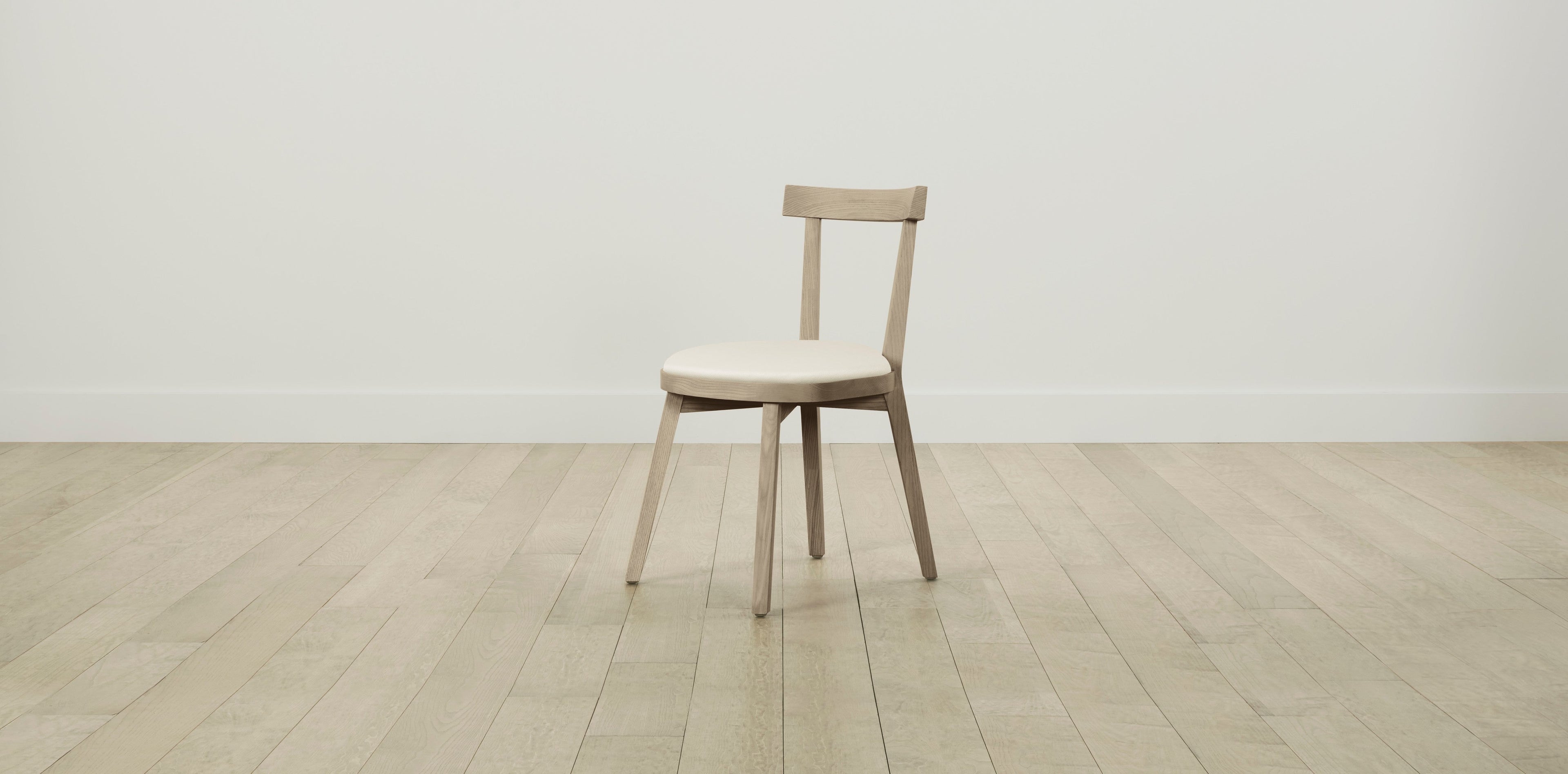 The Allen  - Pebbled Leather Swan Dining Chair