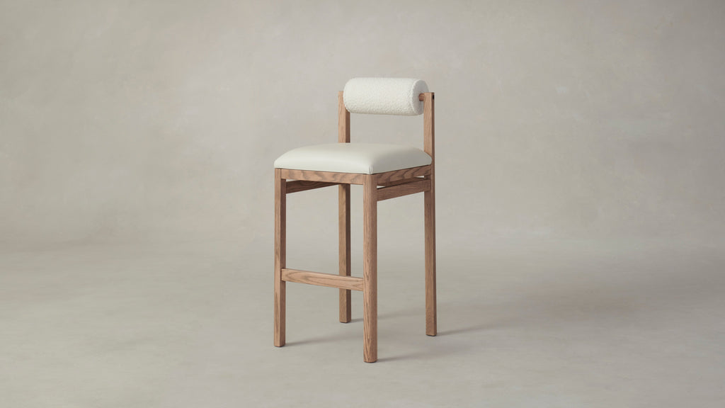 The Thayer  - Pebbled Leather Swan Seat Italian Bouclé White Bolster Bar and Counter Stool
